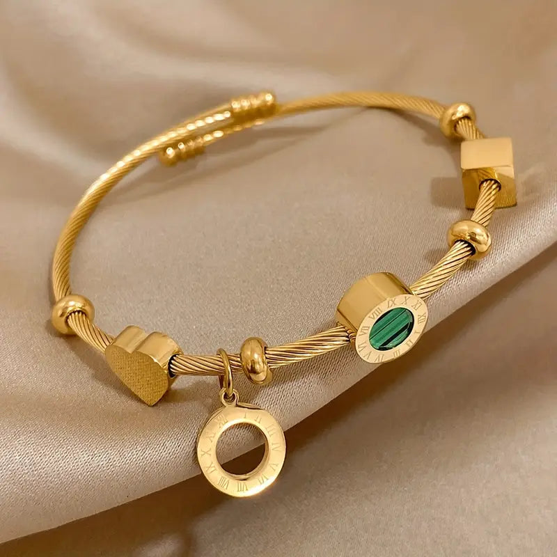Rhian – Pulsera dorada de firma