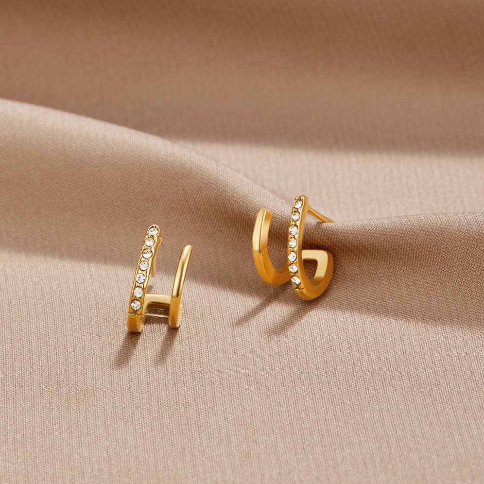 Zendaya – Pendientes de cristal en forma de garra en oro de 18K