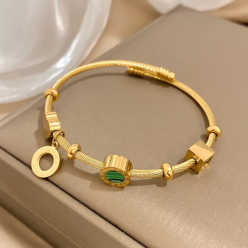 Rhian – Pulsera dorada de firma