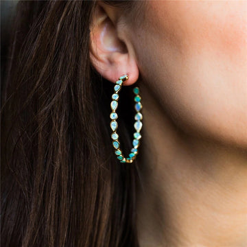 Elegancia luminosa - Pendientes de ópalo azul y oro