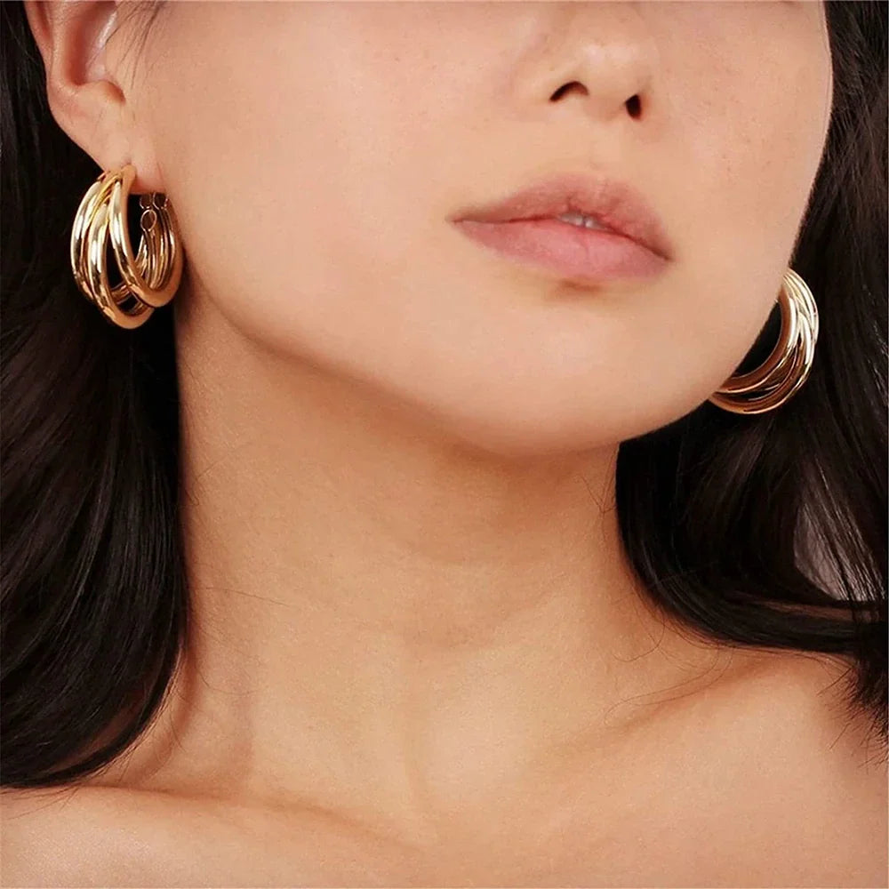Aro de tres ruedas - 3 aros dorados