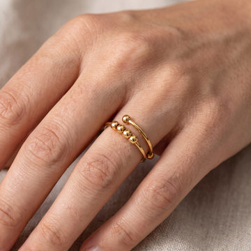 Maelis – Anillo anti-estrés con perlas giratorias