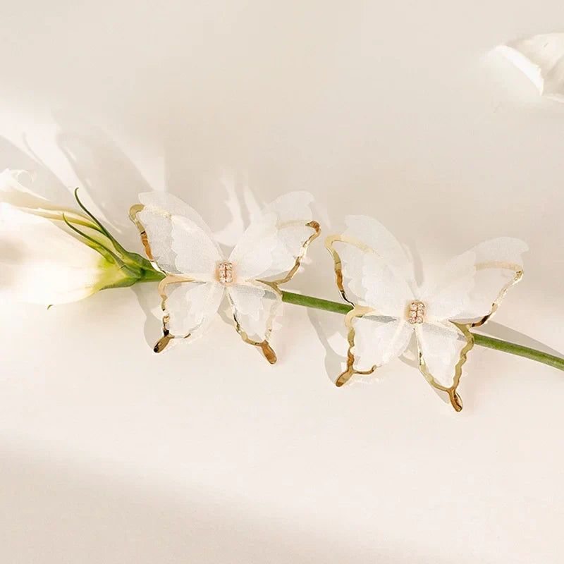 Jean – Pendientes de mariposa de trenzado ligero