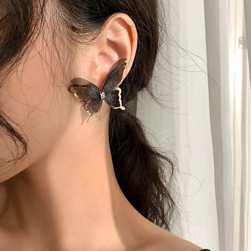 Jean – Pendientes de mariposa de trenzado ligero