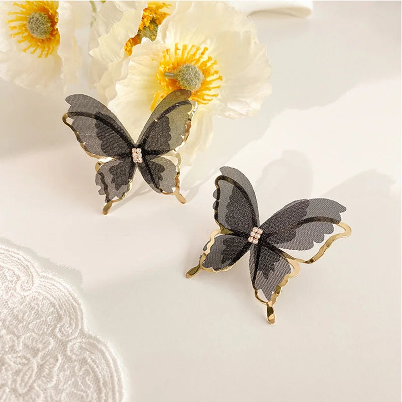 Jean – Pendientes de mariposa de trenzado ligero