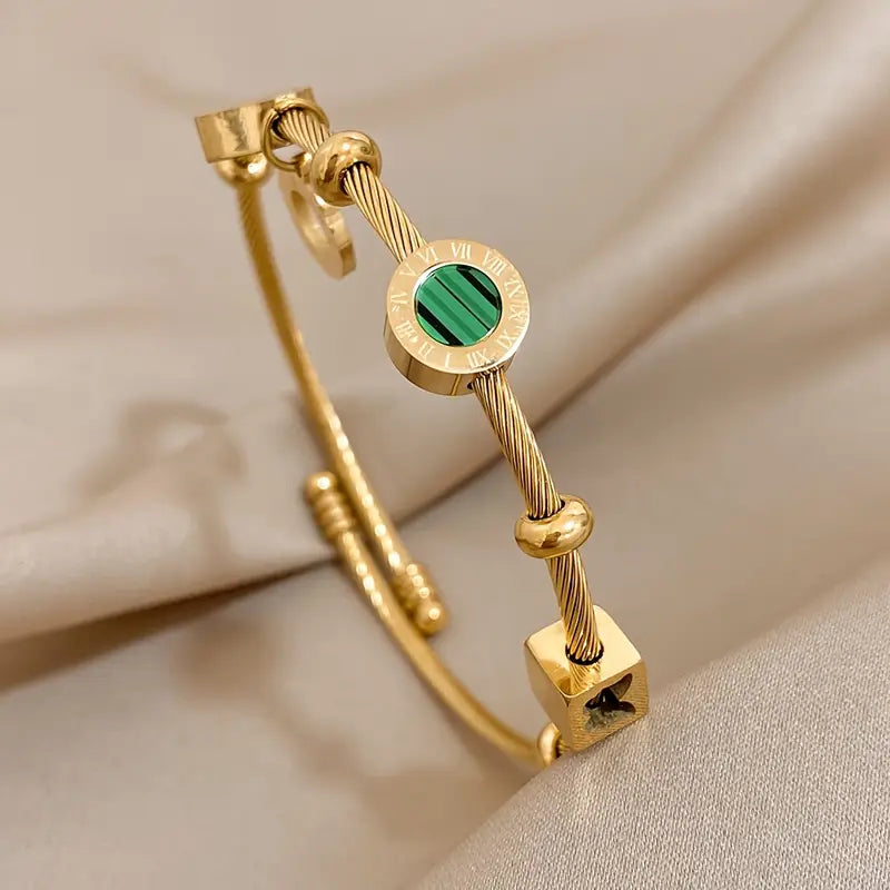 Rhian – Pulsera dorada de firma