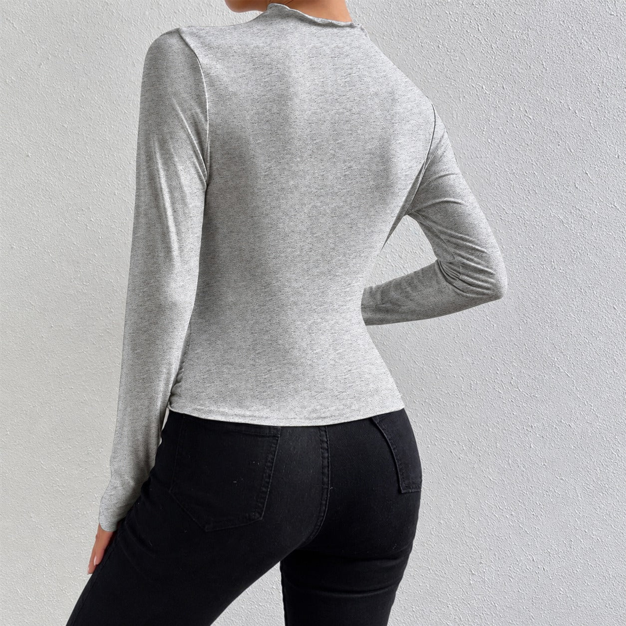 Livia - Camiseta de manga larga ajustada con volantes
