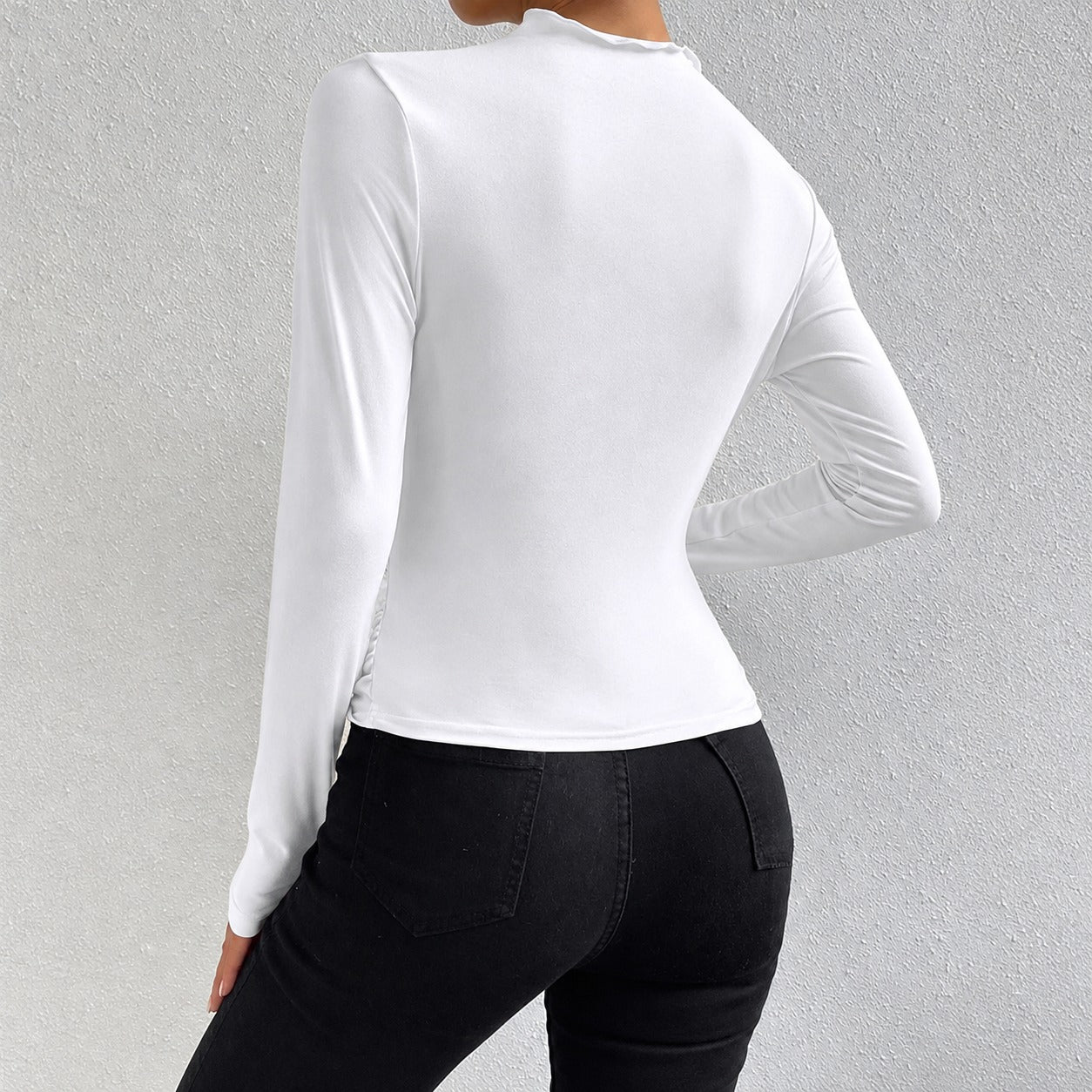 Livia - Camiseta de manga larga ajustada con volantes
