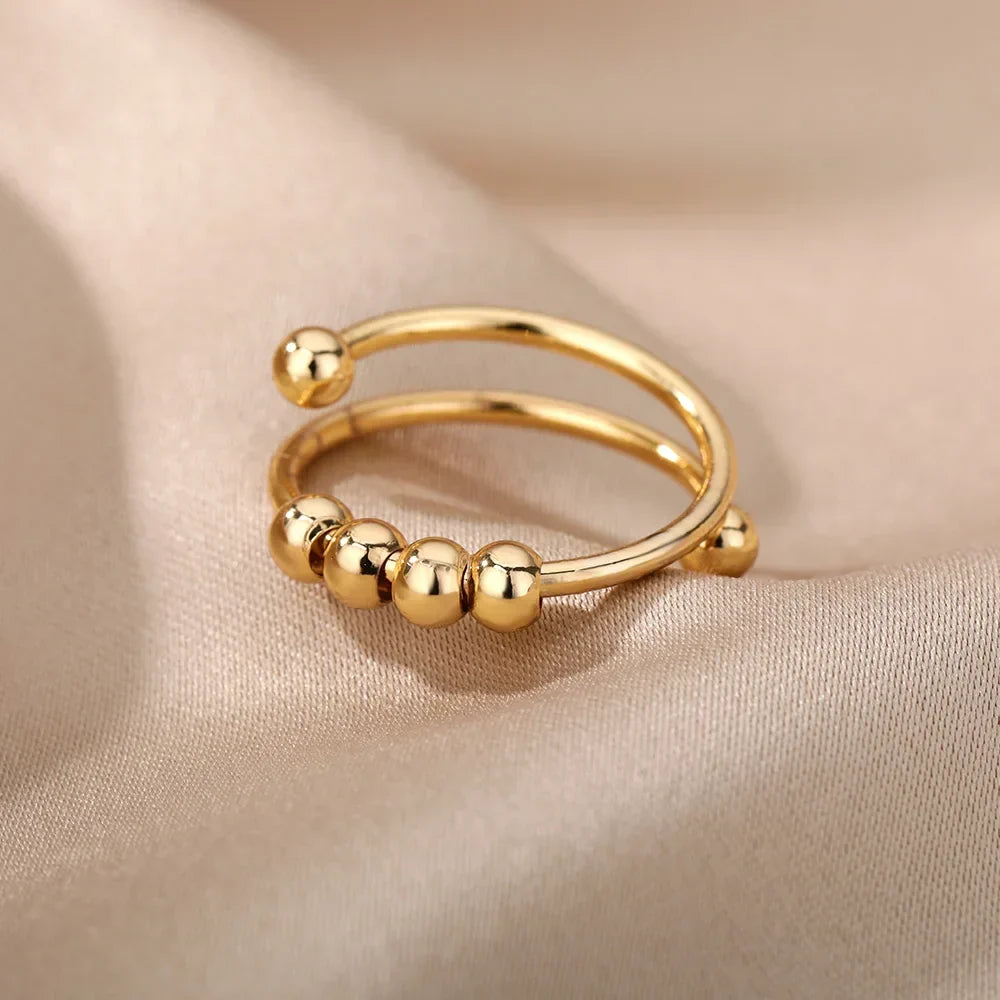 Maelis – Anillo anti-estrés con perlas giratorias