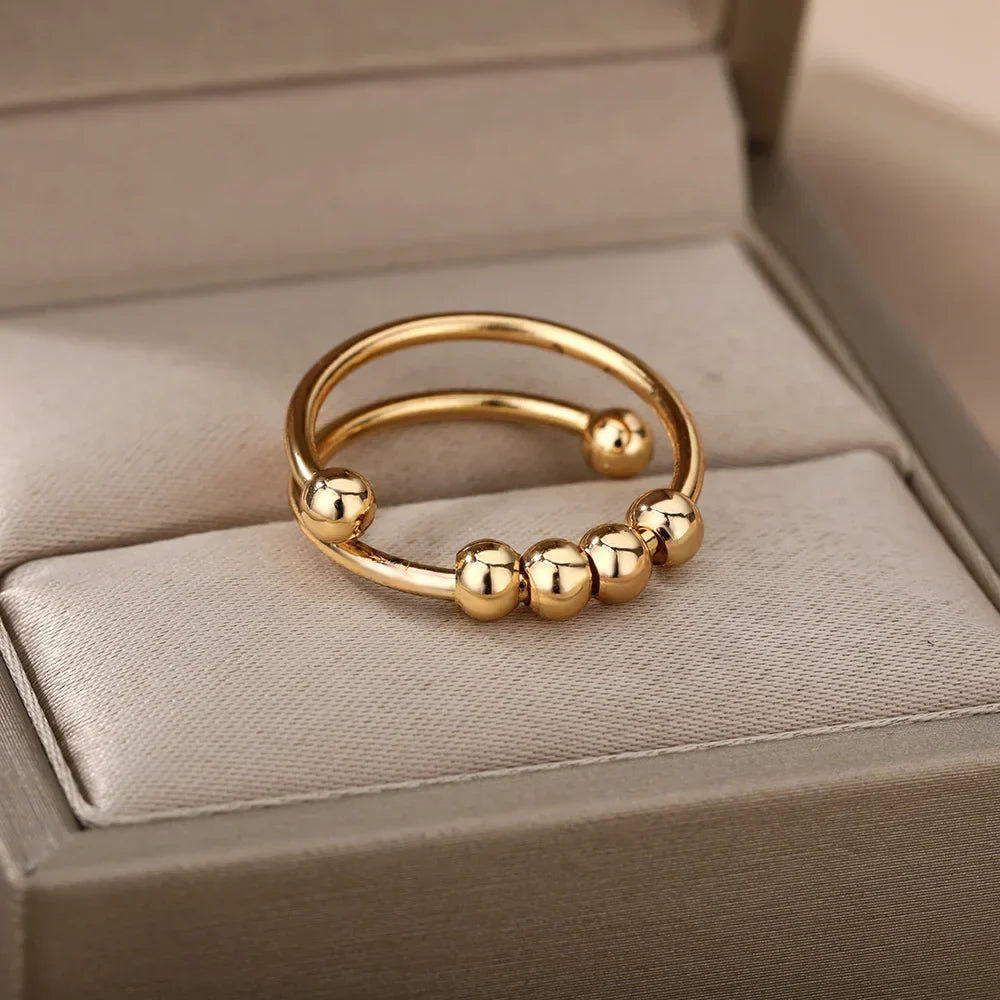 Maelis – Anillo anti-estrés con perlas giratorias