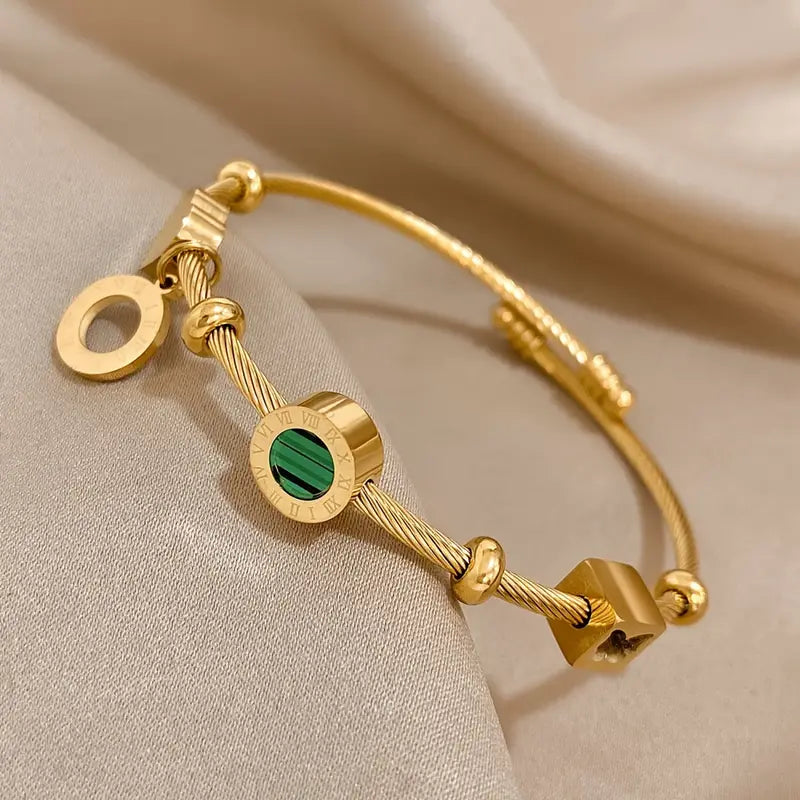 Rhian – Pulsera dorada de firma