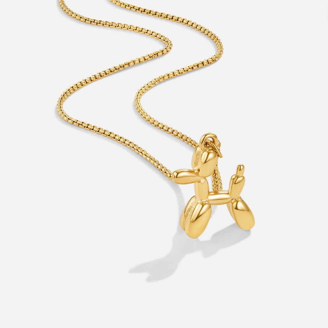 Nerina – Collar con colgante de perro y globo dorado