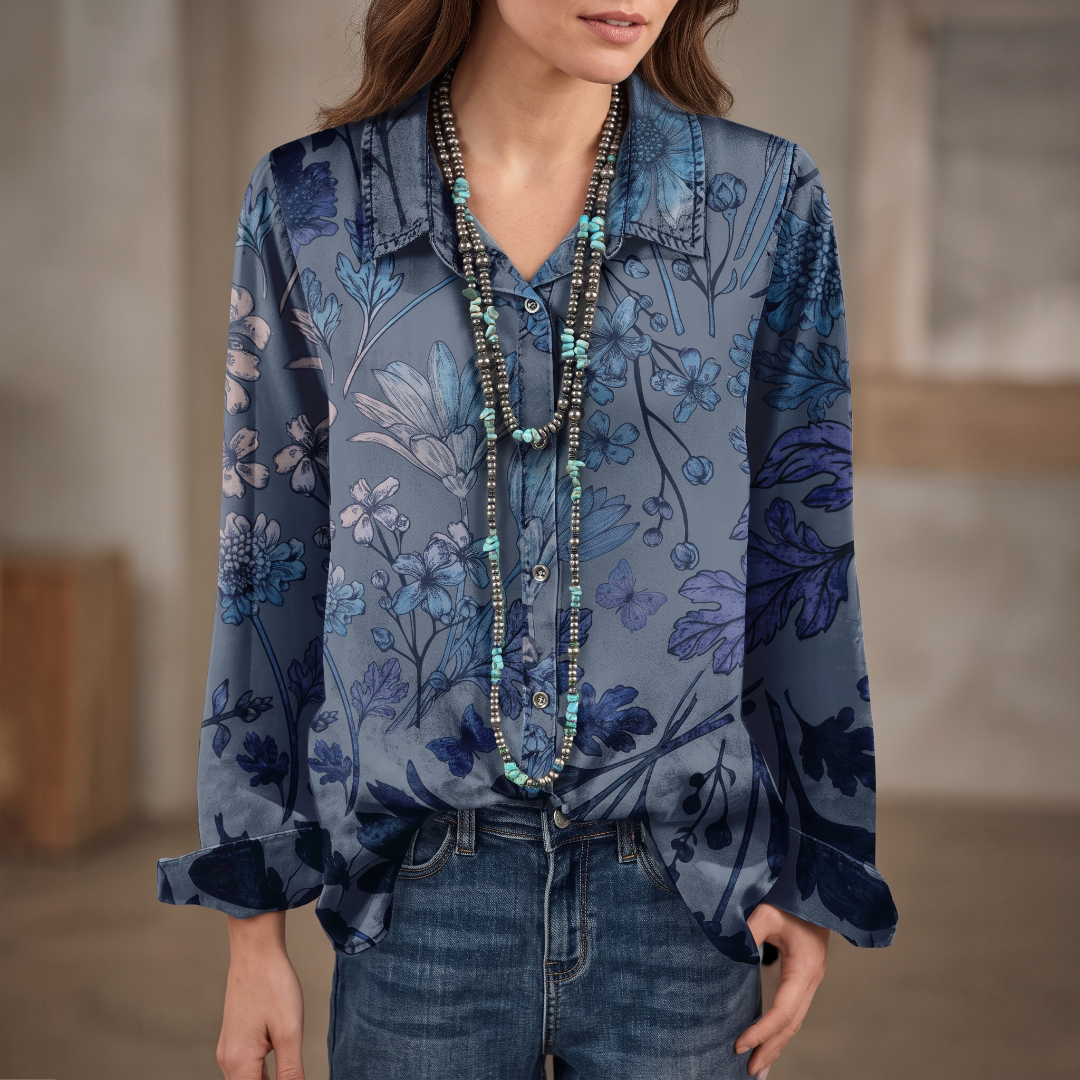 Blusa mujer con cuello banda y escote en V con placket frontal, mangas cortas abullonadas y puños fruncidos, corte holgado, estampado floral