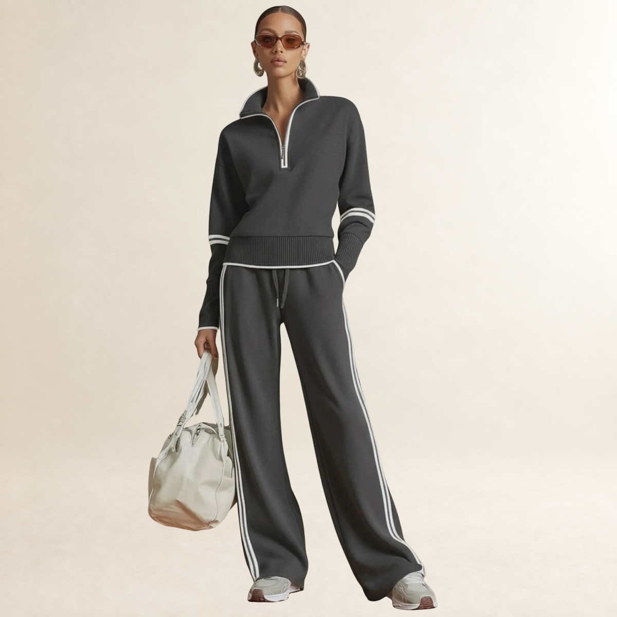 Conjunto de mujer con sudadera de medio cierre y pantalones de pierna ancha con rayas deportivas