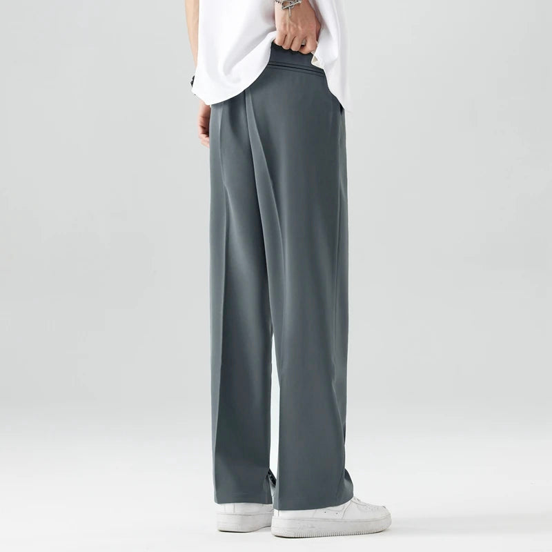 Pantalones de corte ancho para hombre con bolsillos laterales y cintura con botón