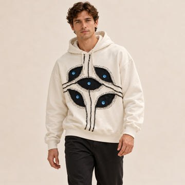 Sudadera con capucha para hombre - corte corto oversize con apliques de parches ojo y capucha con cordón