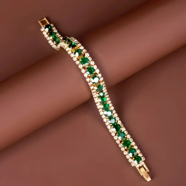 Maud – Pulsera elegante dorada con acentos verdes
