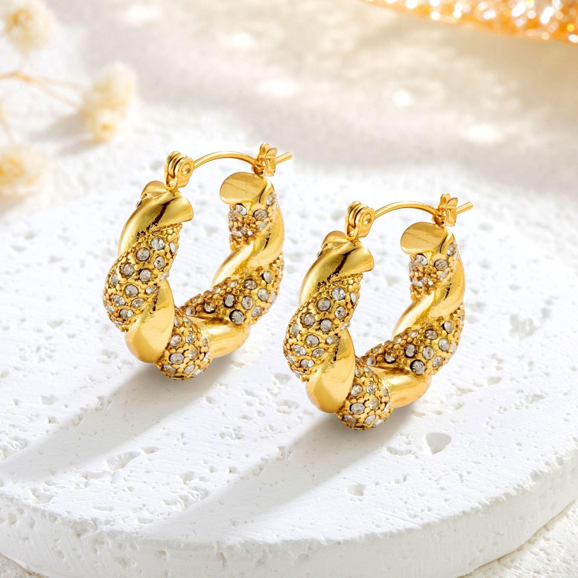 Alix – Pendientes U-Twist en oro