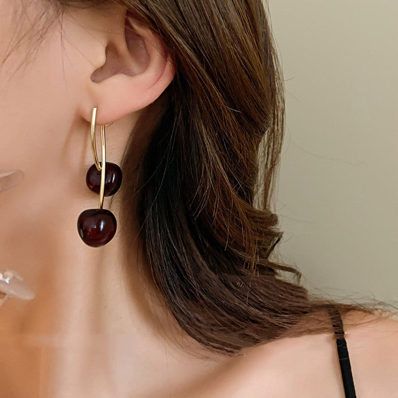 Cheri – Pendientes dorados colgantes de cerezo